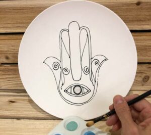 Painting a ceramic plate